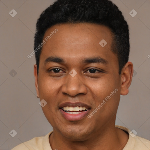 Joyful black young-adult male with short  black hair and brown eyes