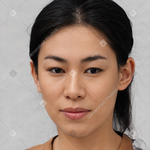 Joyful asian young-adult female with medium  brown hair and brown eyes