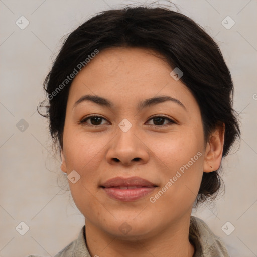 Joyful latino adult female with medium  brown hair and brown eyes