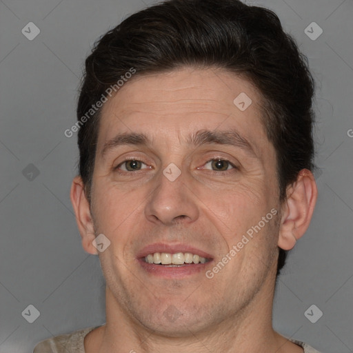 Joyful white adult male with short  brown hair and brown eyes