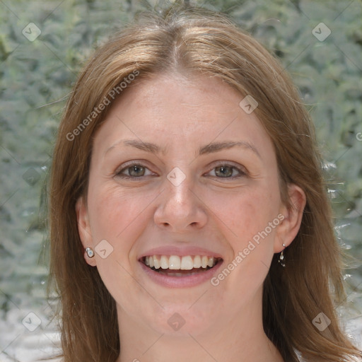 Joyful white adult female with medium  brown hair and grey eyes