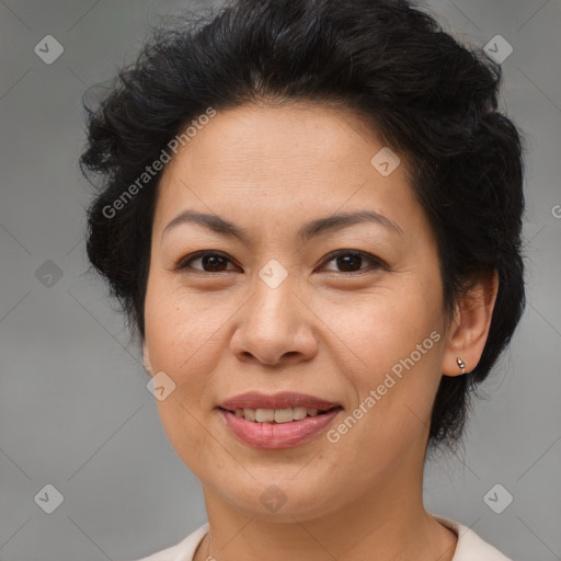 Joyful asian adult female with medium  brown hair and brown eyes