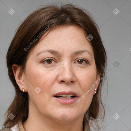 Joyful white adult female with medium  brown hair and grey eyes