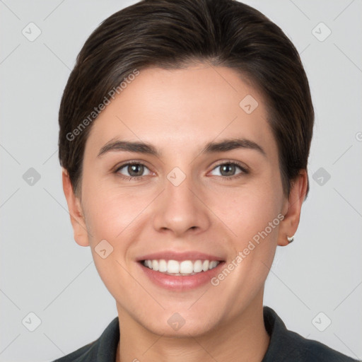 Joyful white young-adult female with short  brown hair and brown eyes