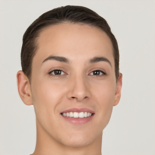 Joyful white young-adult female with short  brown hair and brown eyes