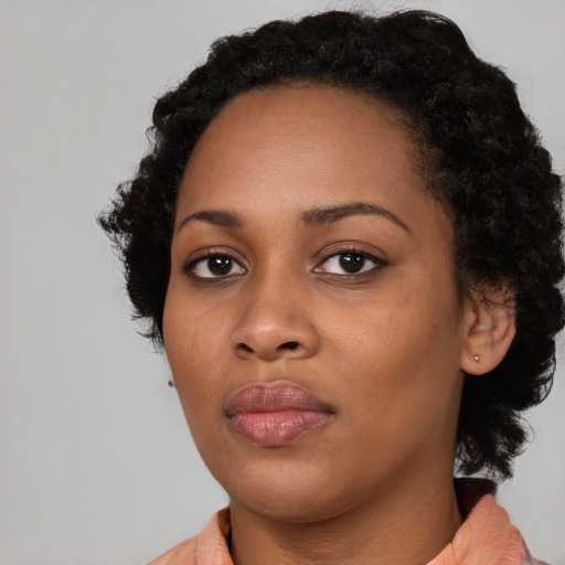 Neutral black young-adult female with medium  black hair and brown eyes