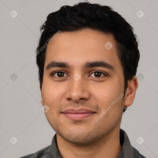 Joyful latino young-adult male with short  black hair and brown eyes