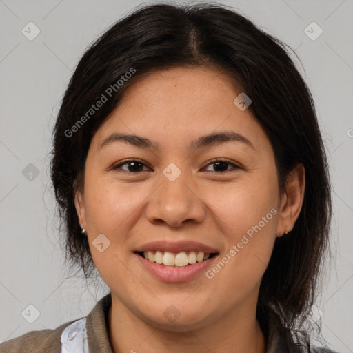 Joyful latino young-adult female with medium  brown hair and brown eyes