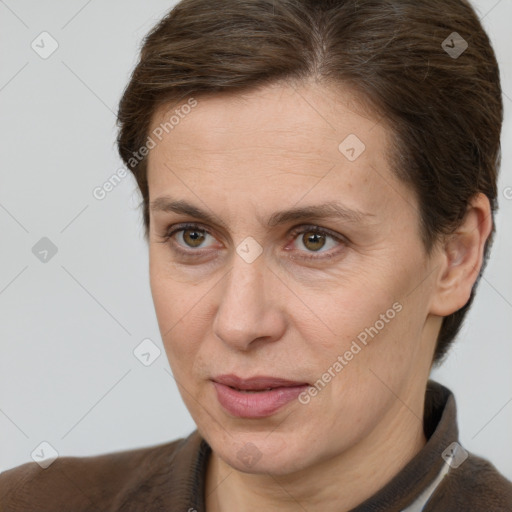 Joyful white adult female with short  brown hair and brown eyes