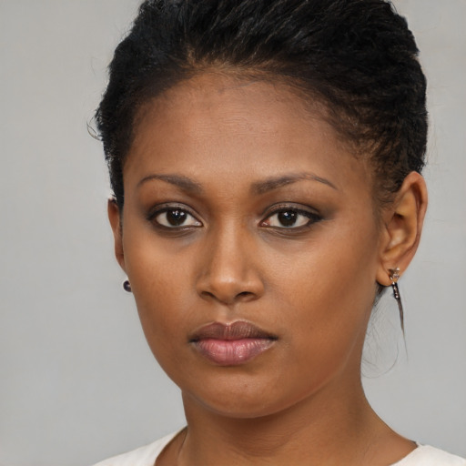 Neutral black young-adult female with short  brown hair and brown eyes