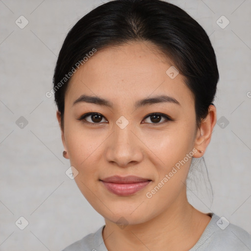 Joyful asian young-adult female with medium  black hair and brown eyes