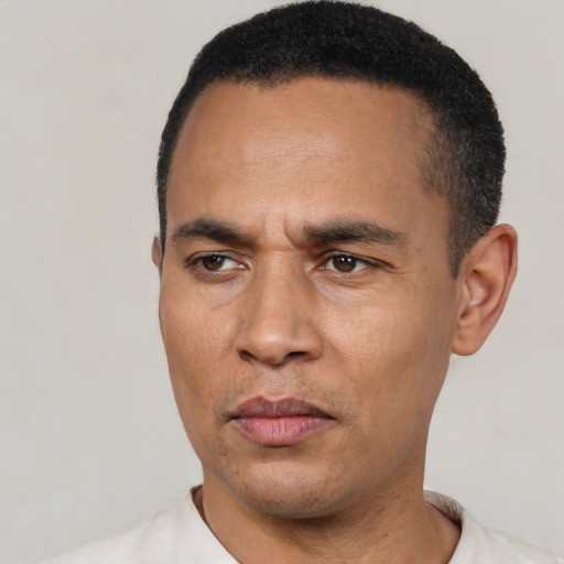Neutral latino adult male with short  black hair and brown eyes