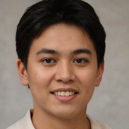 Joyful asian young-adult male with short  brown hair and brown eyes