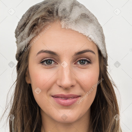 Joyful white young-adult female with long  brown hair and grey eyes