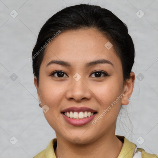 Joyful asian young-adult female with short  brown hair and brown eyes