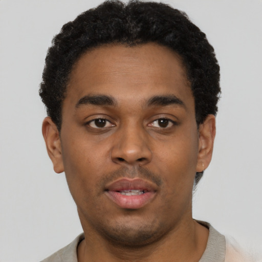 Neutral black young-adult male with short  brown hair and brown eyes