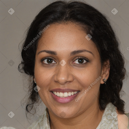 Joyful black adult female with medium  brown hair and brown eyes