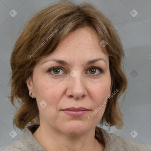 Joyful white adult female with medium  brown hair and grey eyes