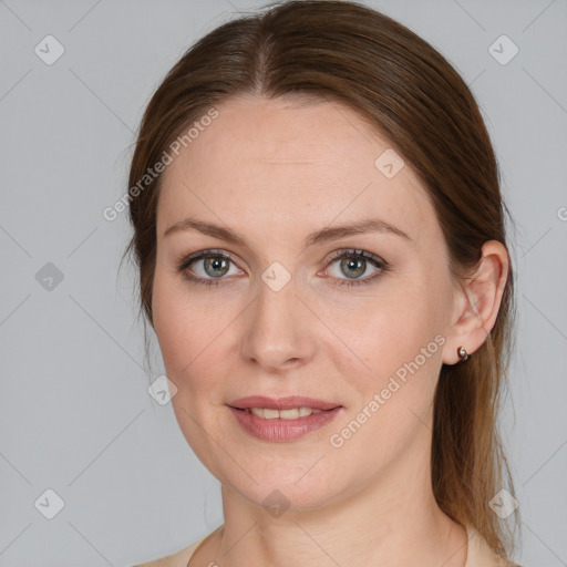 Joyful white young-adult female with medium  brown hair and blue eyes