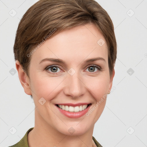 Joyful white young-adult female with short  brown hair and grey eyes