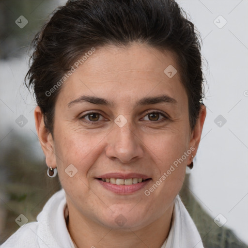 Joyful white adult female with short  brown hair and brown eyes