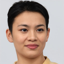 Joyful asian young-adult female with short  brown hair and brown eyes