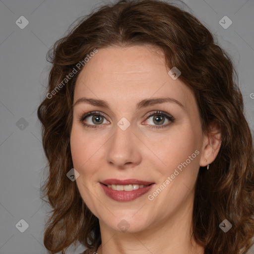 Joyful white young-adult female with medium  brown hair and green eyes