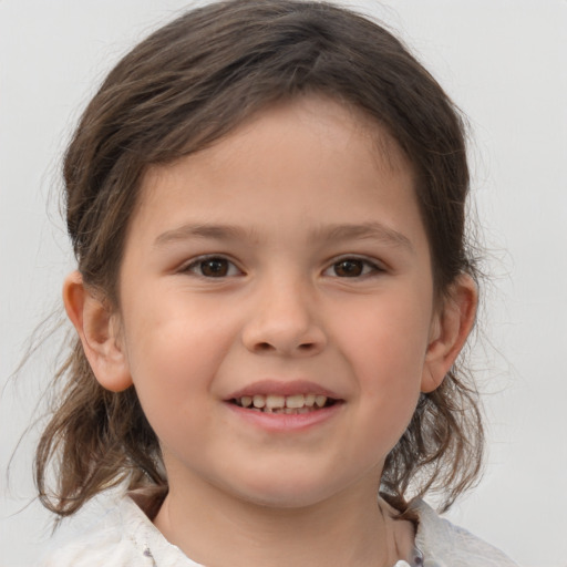 Joyful white child female with medium  brown hair and brown eyes