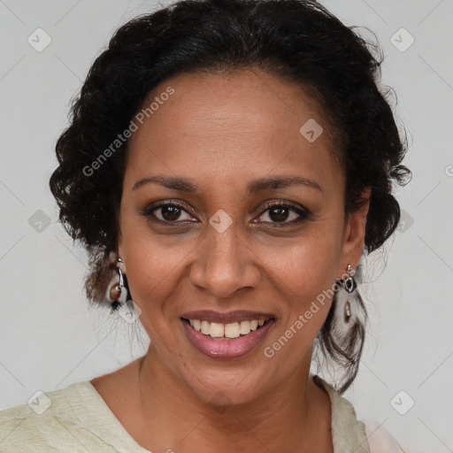 Joyful black adult female with medium  brown hair and brown eyes