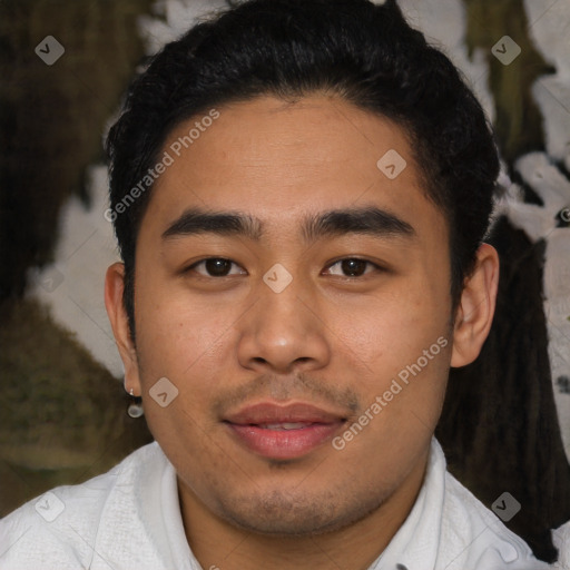 Joyful latino young-adult male with short  black hair and brown eyes