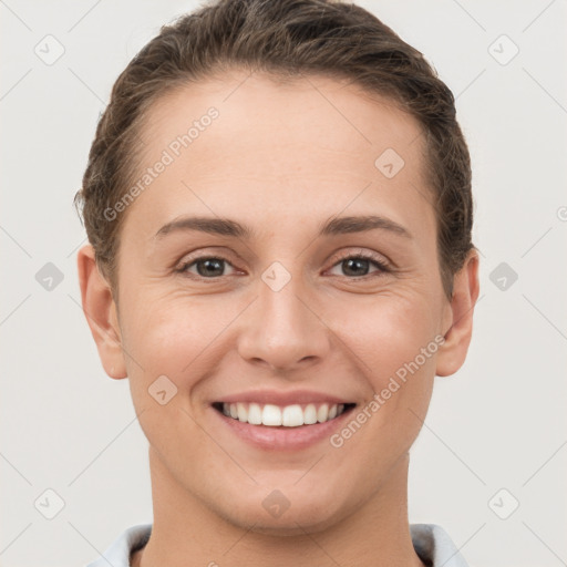 Joyful white young-adult female with short  brown hair and brown eyes