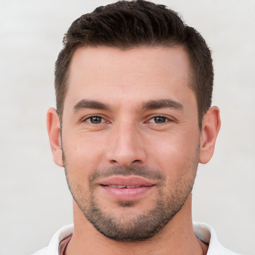 Joyful white young-adult male with short  brown hair and brown eyes