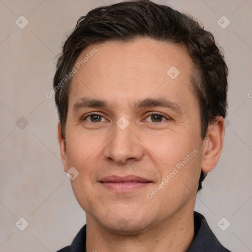 Joyful white adult male with short  brown hair and brown eyes