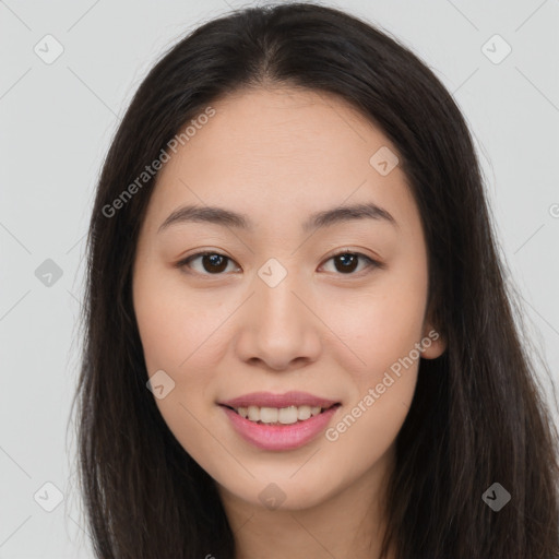 Joyful asian young-adult female with long  brown hair and brown eyes