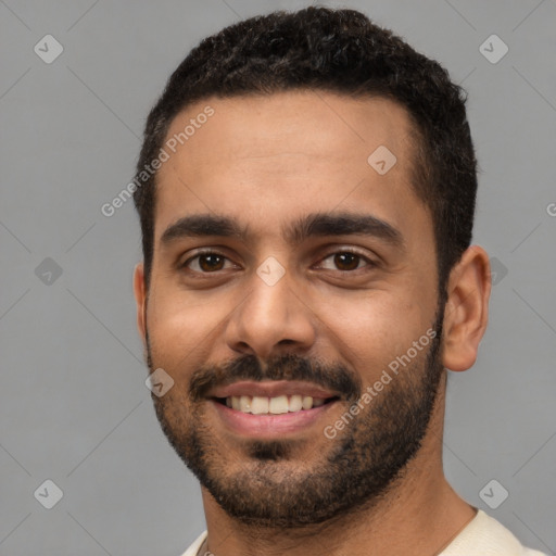 Joyful white young-adult male with short  black hair and brown eyes