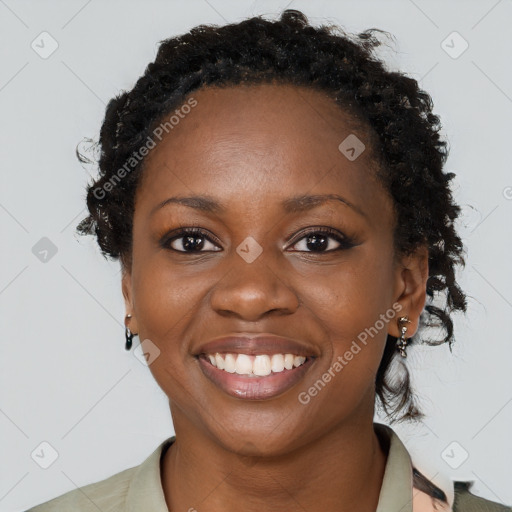 Joyful black young-adult female with long  brown hair and brown eyes