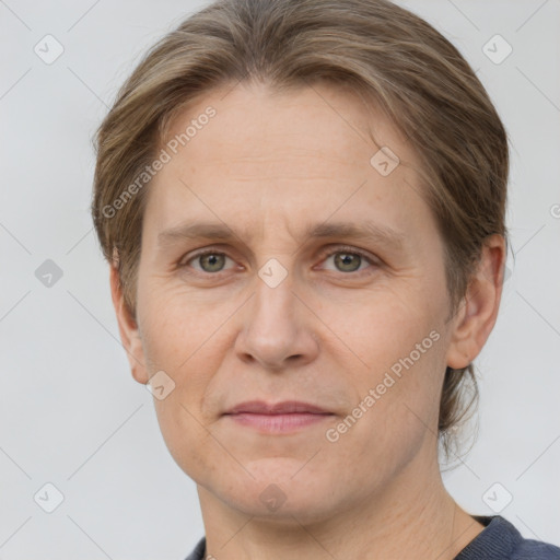 Joyful white adult female with short  brown hair and grey eyes