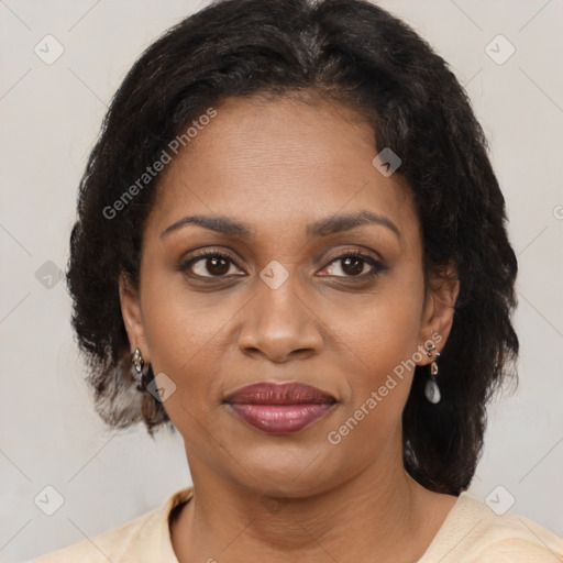 Joyful black adult female with medium  brown hair and brown eyes