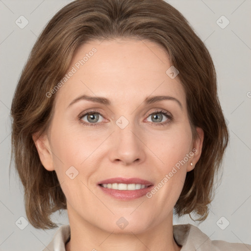 Joyful white adult female with medium  brown hair and grey eyes