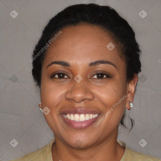 Joyful black young-adult female with short  brown hair and brown eyes