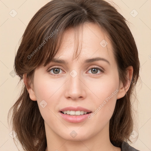 Joyful white young-adult female with medium  brown hair and brown eyes