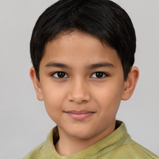 Joyful asian child male with short  brown hair and brown eyes