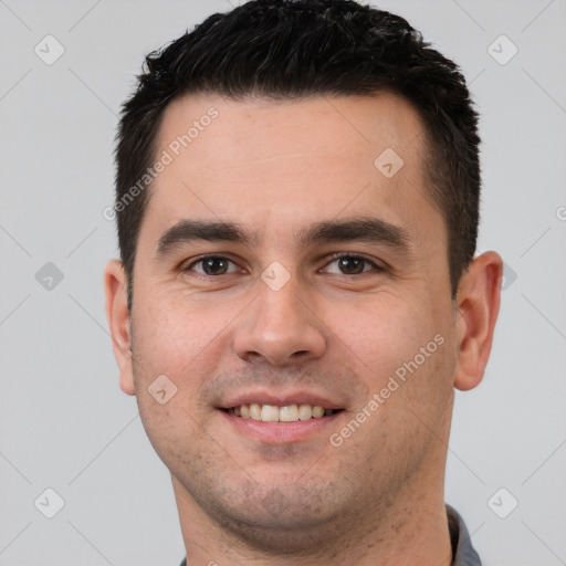 Joyful white young-adult male with short  brown hair and brown eyes