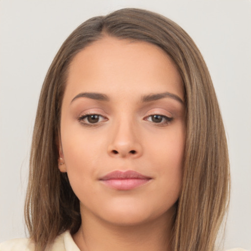 Neutral white young-adult female with long  brown hair and brown eyes