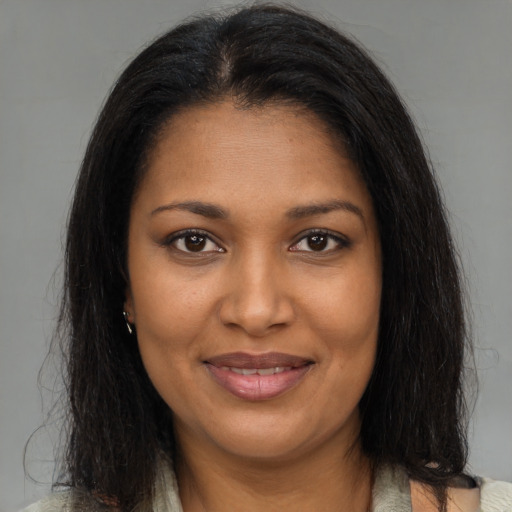 Joyful black young-adult female with medium  brown hair and brown eyes