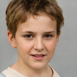 Joyful white child male with short  brown hair and brown eyes