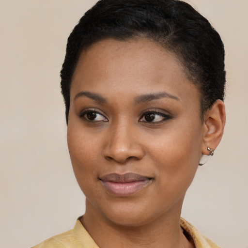 Joyful latino young-adult female with short  brown hair and brown eyes