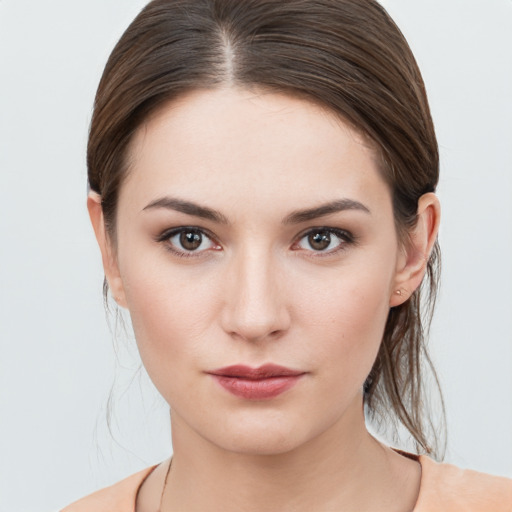 Neutral white young-adult female with medium  brown hair and brown eyes