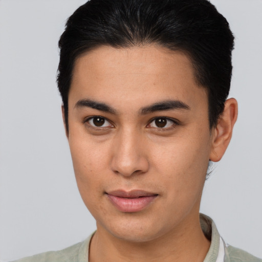 Joyful latino young-adult male with short  brown hair and brown eyes