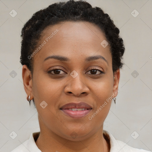 Joyful black young-adult female with short  brown hair and brown eyes